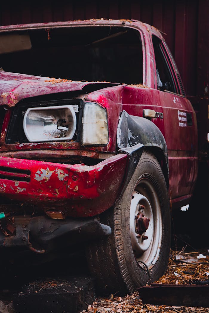 Services Explore the rustic charm and urban decay of this abandoned vintage car with rusted metal and weathered details.